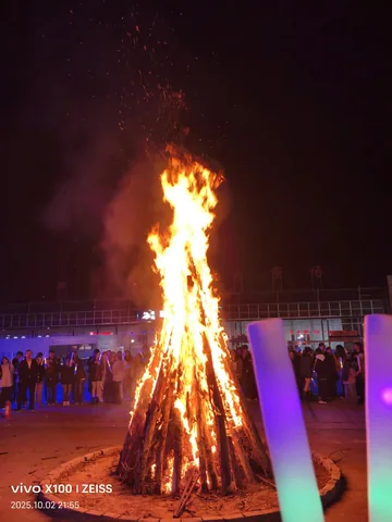 A campus bonfire glowing at night