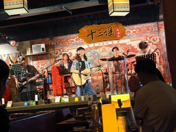 A live band playing in a warm music venue